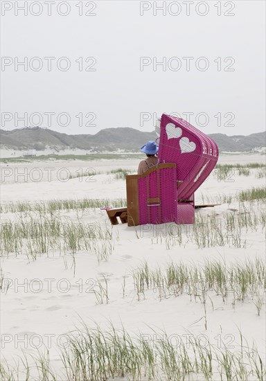 Beach chair with two hearts at the beach