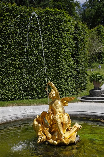 Fountain figure love god Cupid with bow and arrow