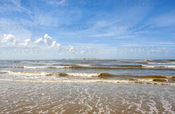 Sandy beach beach at the harbour of the island Baltrum