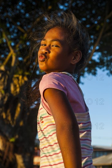 Young girl posing as western actors