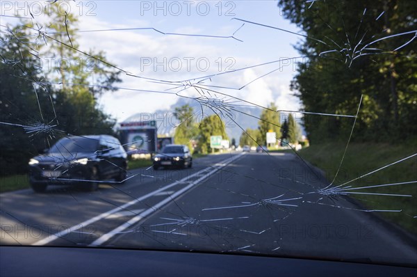 Shattered windscreen due to hailstones on a car