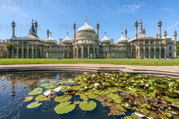 Royal Pavilion palace reflected with a pond with water lilies