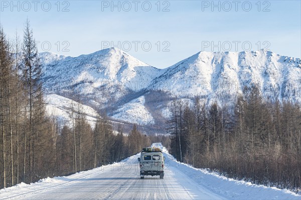 Minivan driving on the Road of Bones