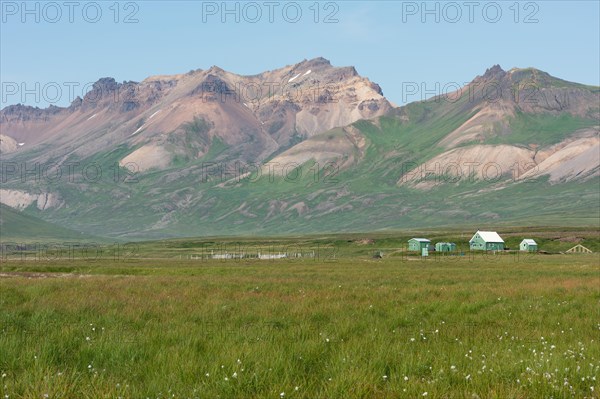 Cabins of the Icelandic Hiking Association and coloured rhyolite mountains