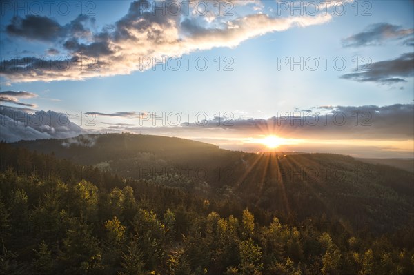 Sunset over forest at viewpoint Ilmenauer Balkon