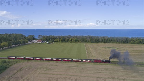 Steam train Molli at the sea buckthorn beach