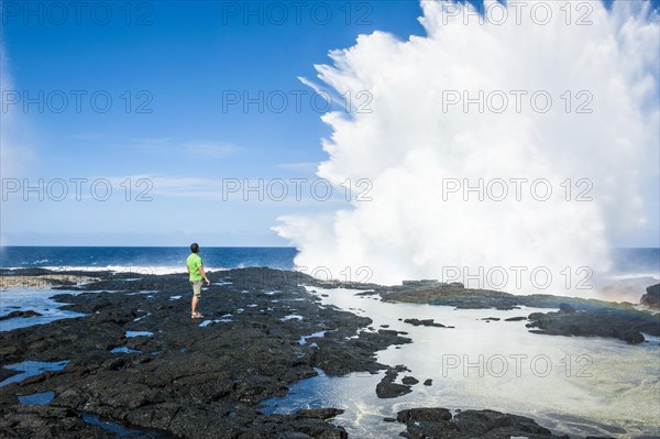 Tourist enjoying the huge waves in the Alofaaga blowholes on the south of SavaiÂ´i