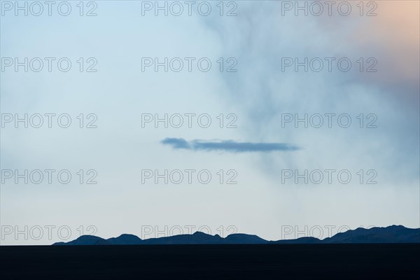 Rain showers over lava desert