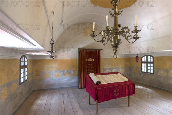 Table with Torah scroll and Torah cupboard in the synagogue in the Judenhof
