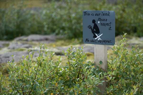 Hand-painted sign This is our land