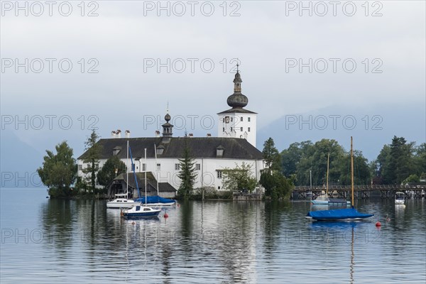 Orth Castle on Lake Traun in Gmunden with boats