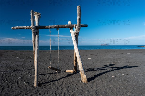 Swing made of driftwood