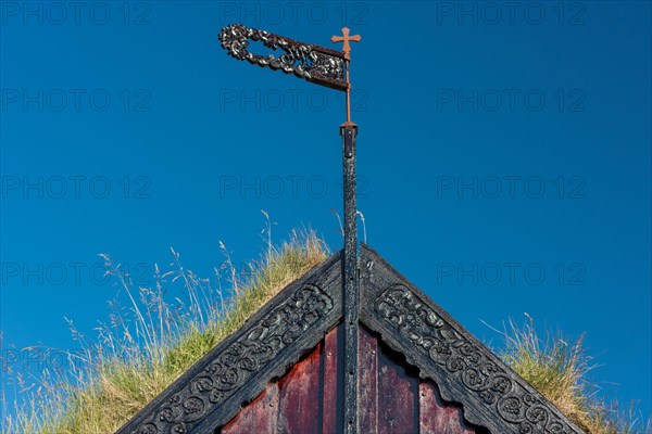 Panel and grass roof decorated with carvings