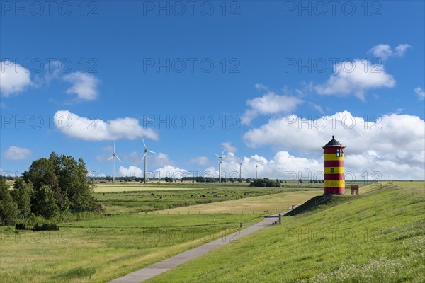 Dike landscape with Pilsum lighthouse