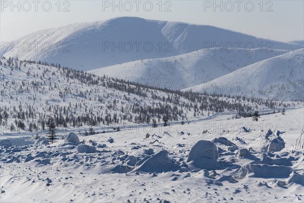 Snow covered mountains along the Road of Bones