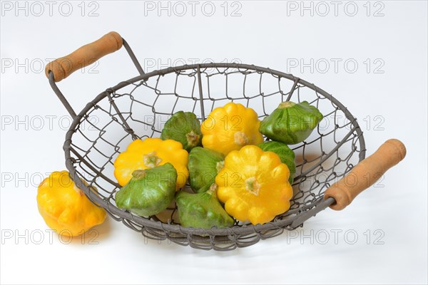 Patisson pumpkins in wire bowl