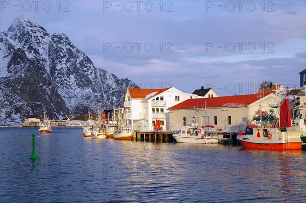 Small fishing boats in front of wooden houses