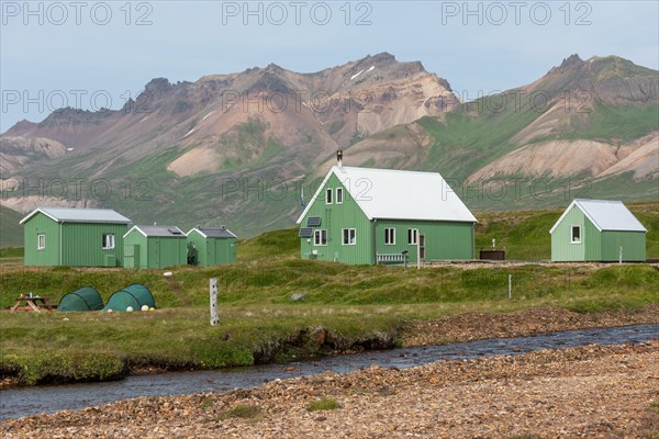 Cabins of the Icelandic Hiking Association and coloured rhyolite mountains