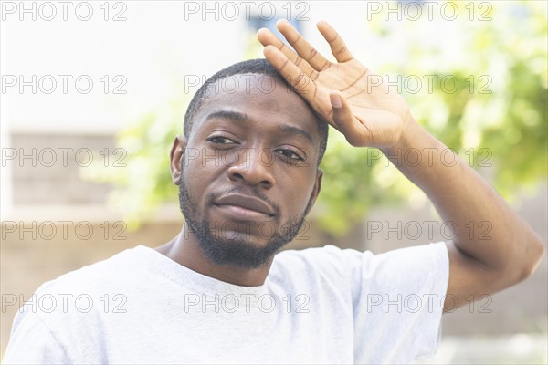 Young black man after fitness in the summer of the city
