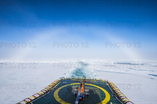 Fog bow or white rainbow in the ice around the North Pole