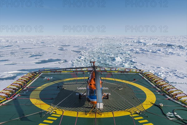 Helicopter on the Helipad of the Icebreaker '50 years of victory' on its way to the North Pole breaking through the ice