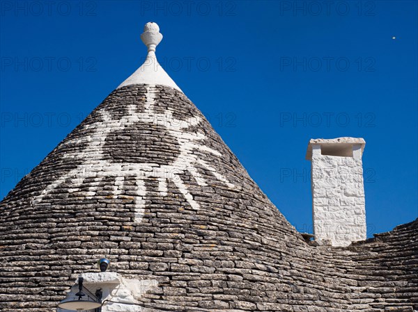 Round slate roof with sun