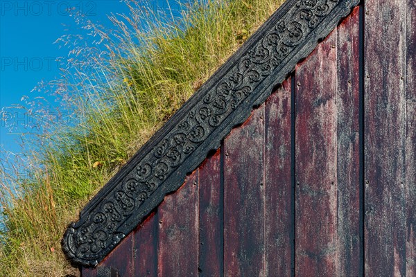 Panel and grass roof decorated with carvings