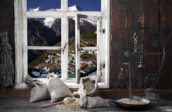 View from the farmer's kitchen with grain sacks and scales into the landscape