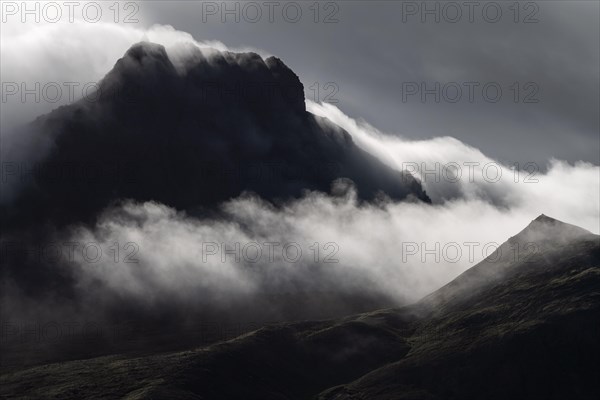 Cloudy craggy mountain