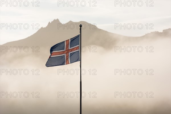 Cabins of the Icelandic Hiking Association in front of the mountain range Dyrfjoell