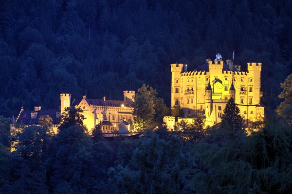 Illuminated castle Hohenschwangau at night