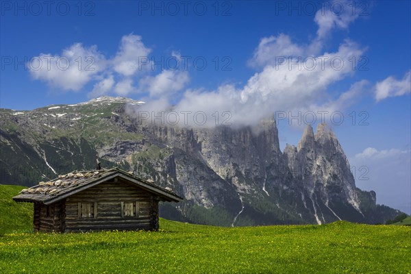 Alpine huts in front of the Schlern massif