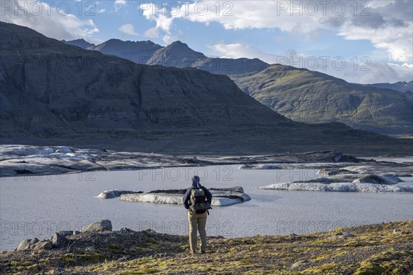 Woman looking over glacial lake