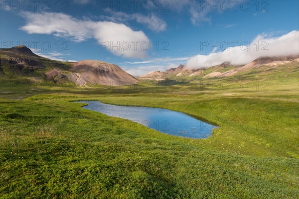 Lake and coloured rhyolite mountains