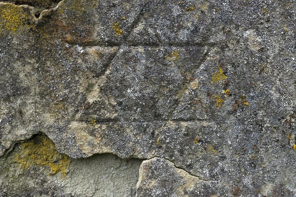 Weathered Star of David on a gravestone