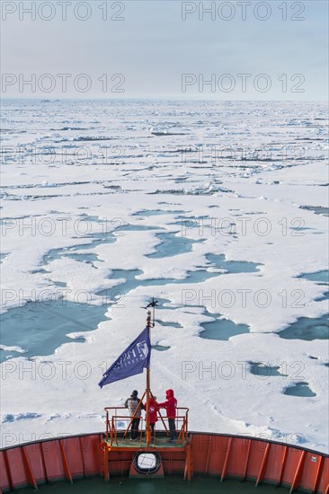 Tourists watching the ice breaking on board of an icebreaker