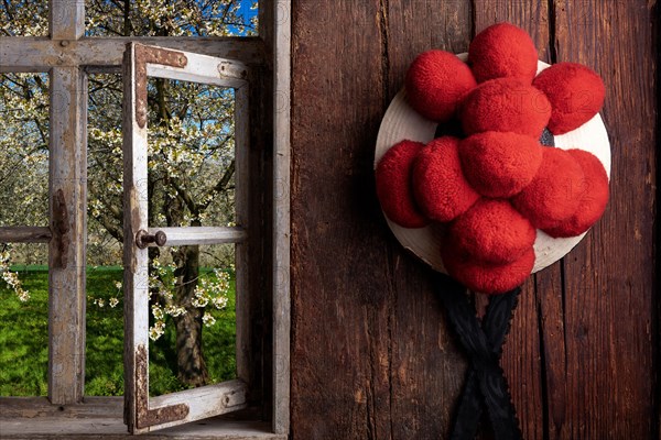 Rustic farmhouse parlor with Bollen hat and view out of the window into the landscape