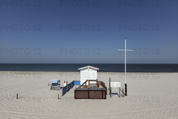 Deserted beach with lifeguard hut