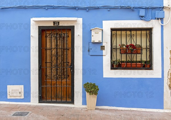 Close-up of door and window of blue fishermen's houses in Villajoyosa
