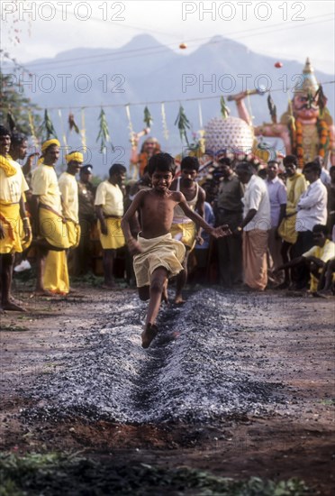 A boy running on burning coal