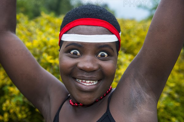 Woman starring at the camera at a ceremony of former poachers