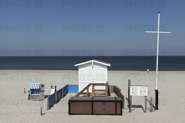 Deserted beach with lifeguard hut