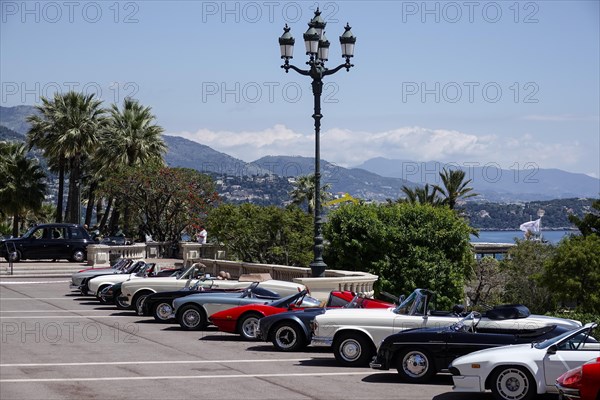 Vintage car parked in front of the seaside Opera de Monte-Carlo