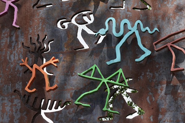 Colourful figures on a steel slab