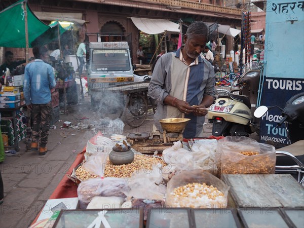 Vendor offers pulses at the market stall