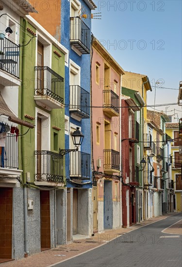 Narrow street with colorful houses in seaside town of Villajoyosa