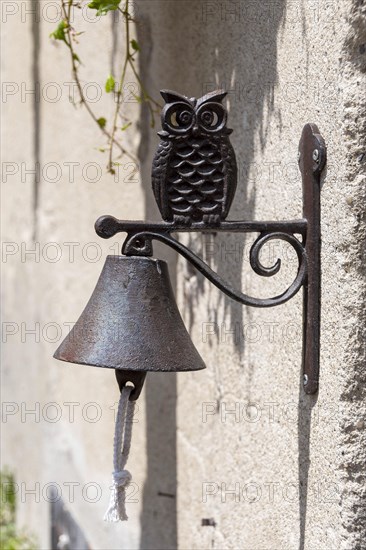 Bell on a wall in the shape of an owl