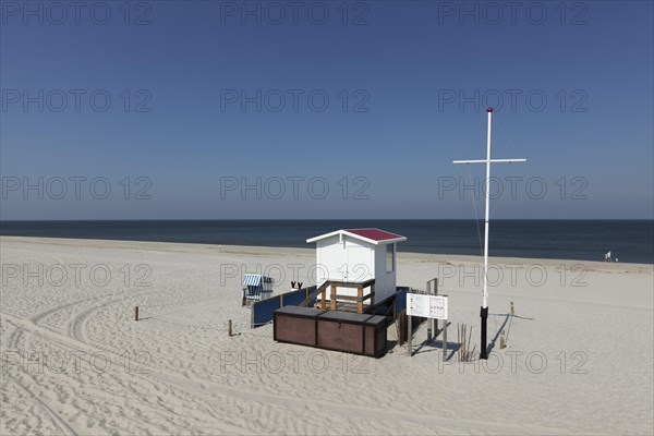 Deserted beach with lifeguard hut