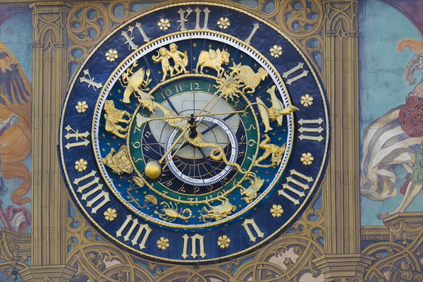 Richly decorated astronomical clock with signs of the zodiac at the town hall