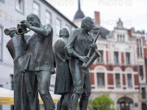 Sculpture Muenzenberger Musikanten on the fountain at the market place in Quedlinburg